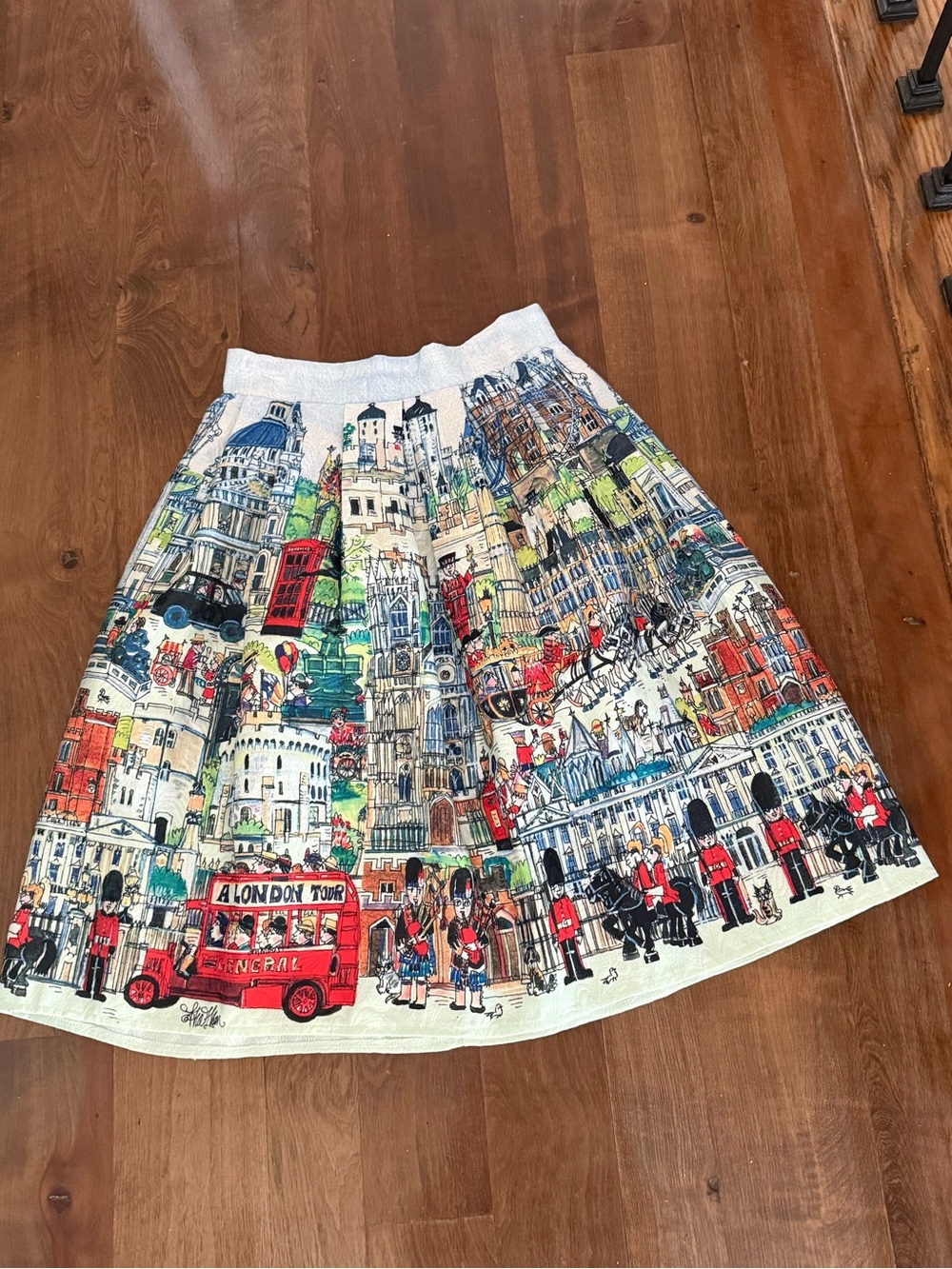 Skirt brand NEW with tags London England size XS (2) waist 13.5 elastic on back.